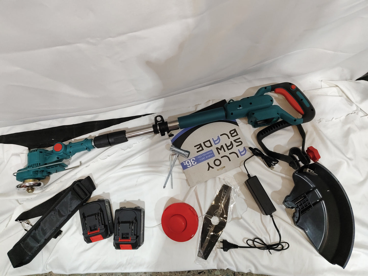 Folding Lithium Mower Electric Lawn Mower and accessories including batteries, blades, and protective gear.