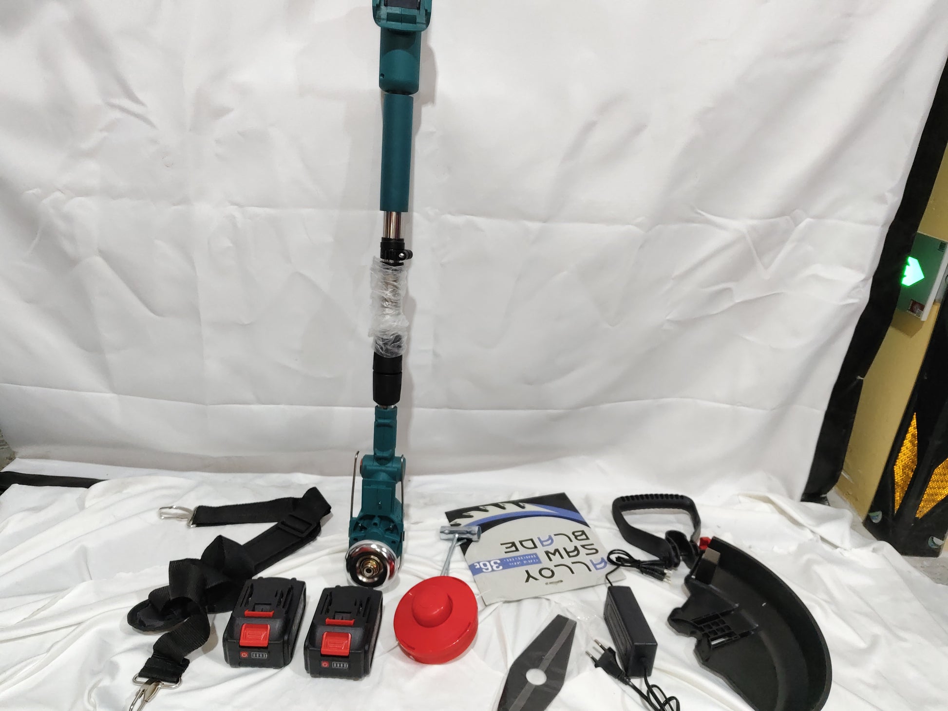 Folding Lithium Mower Electric Lawn Mower with batteries, blades, and accessories on a white background.