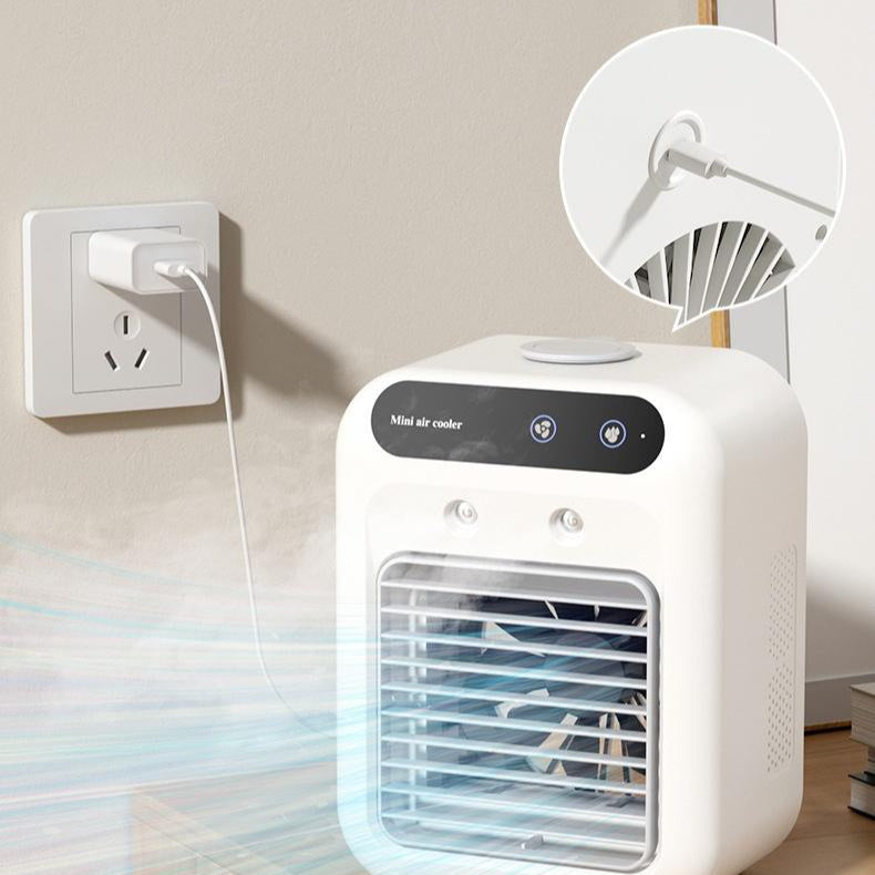Air Conditioner Air Cooler Fan with misting feature, plugged into wall outlet, providing cool air for comfort.