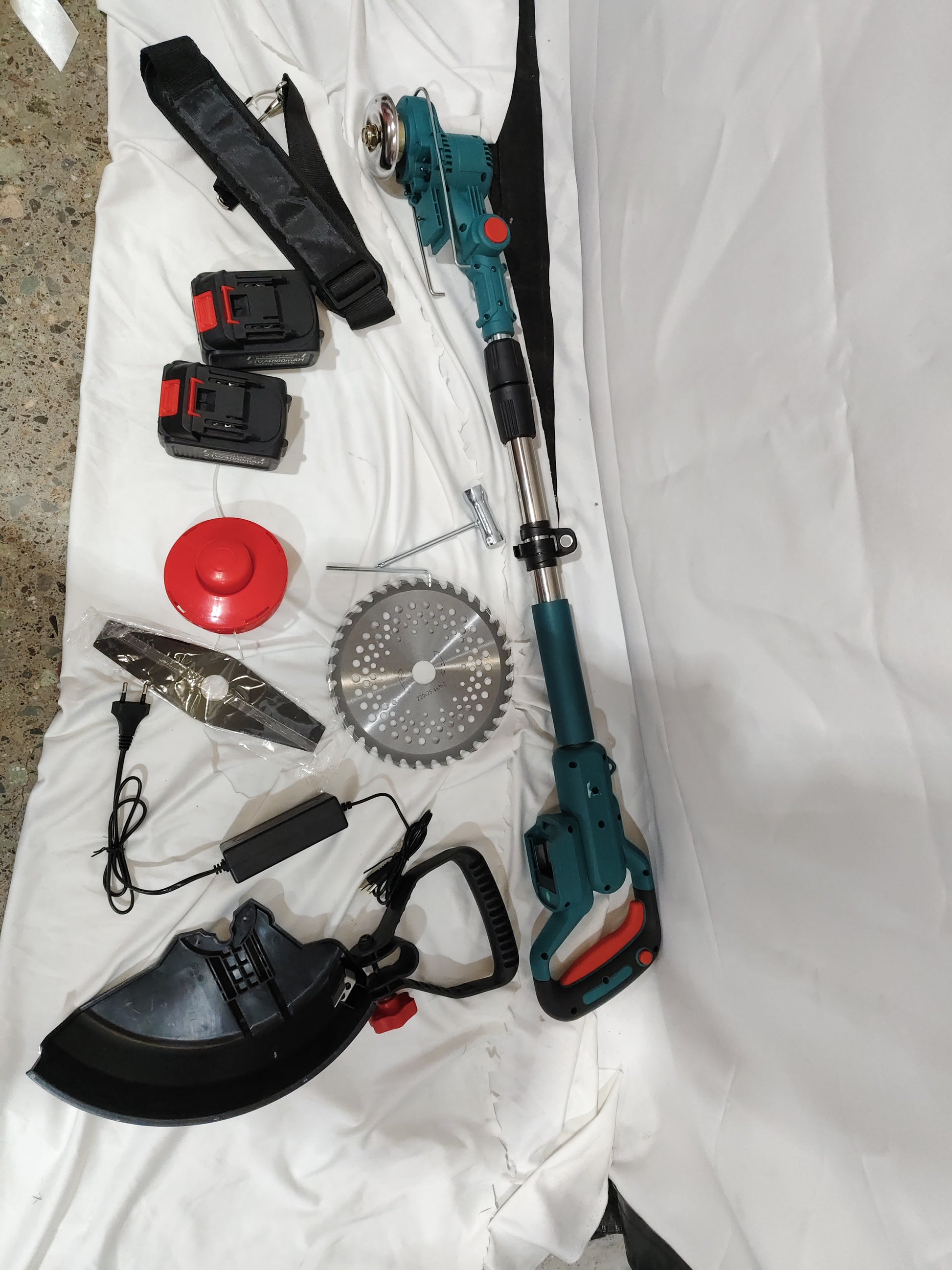 Folding Lithium Mower Electric Lawn Mower components including blades, batteries, and handle, all laid out on a white background.